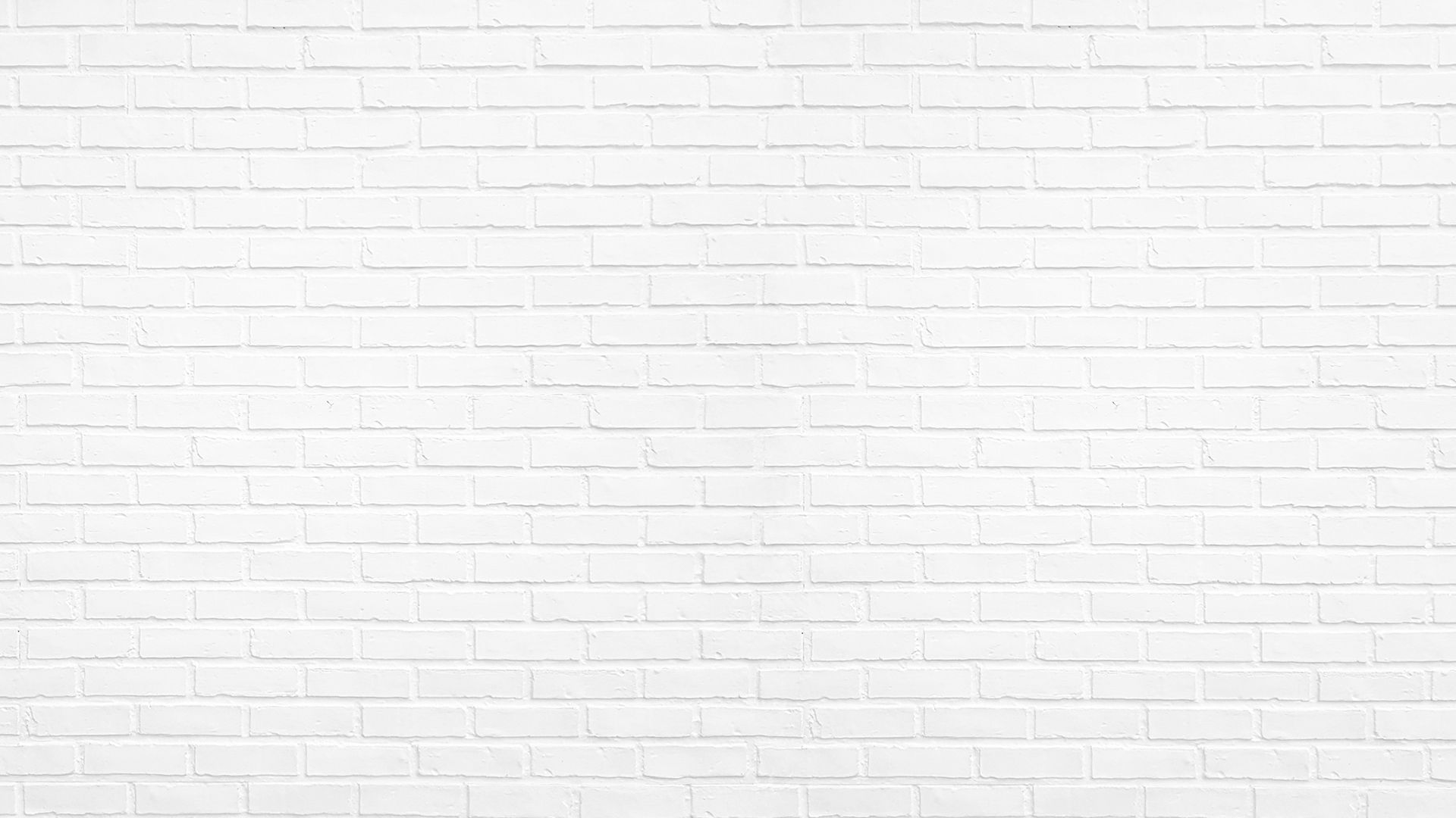 Eine glatte weiße Ziegelwand mit gleichmäßiger Textur und Fugen, die einen sauberen und minimalistischen Hintergrund schafft.